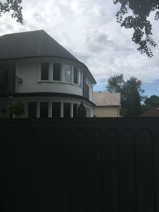 Rounded bay window with a curved eavestrough following the roofline